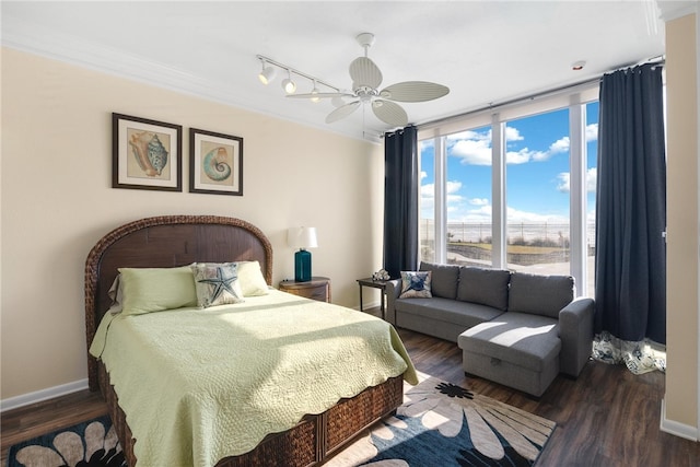 bedroom with crown molding, ceiling fan, and dark wood-type flooring