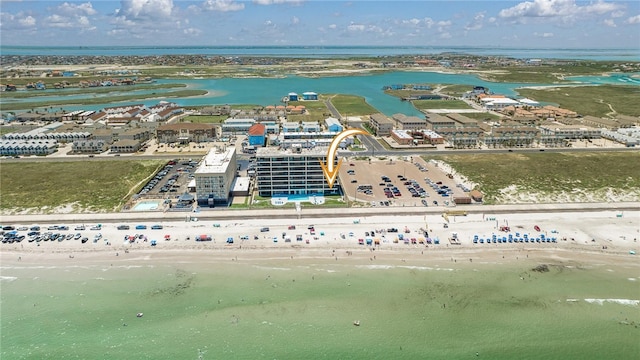 bird's eye view with a water view and a view of the beach