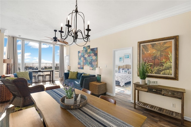 dining area with hardwood / wood-style floors, ceiling fan with notable chandelier, floor to ceiling windows, and ornamental molding