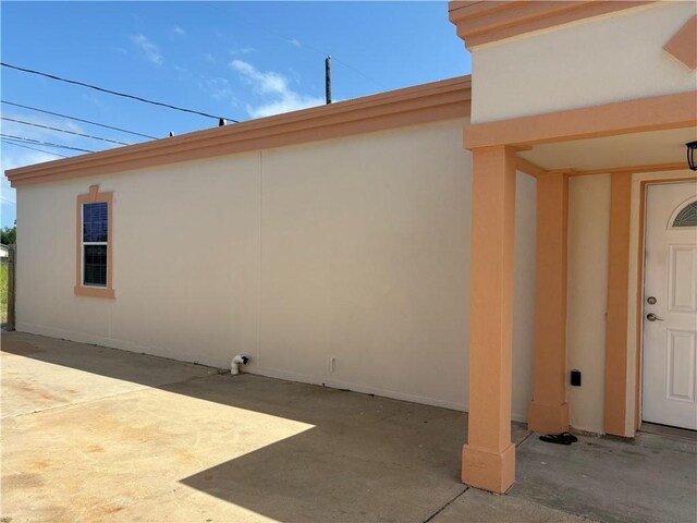 915 Flour Bluff Dr, Corpus Christi, TX 78418 - entrance to property featuring stucco siding and a patio