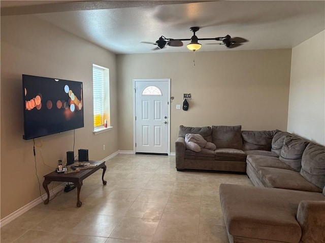 915 Flour Bluff Dr, Corpus Christi, TX 78418 - living room with ceiling fan, light tile patterned flooring, and baseboards