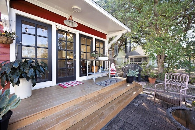 wooden terrace featuring grilling area