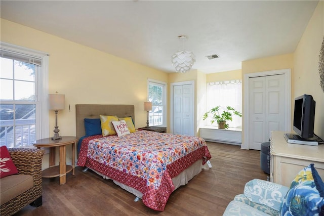 bedroom featuring dark hardwood / wood-style flooring