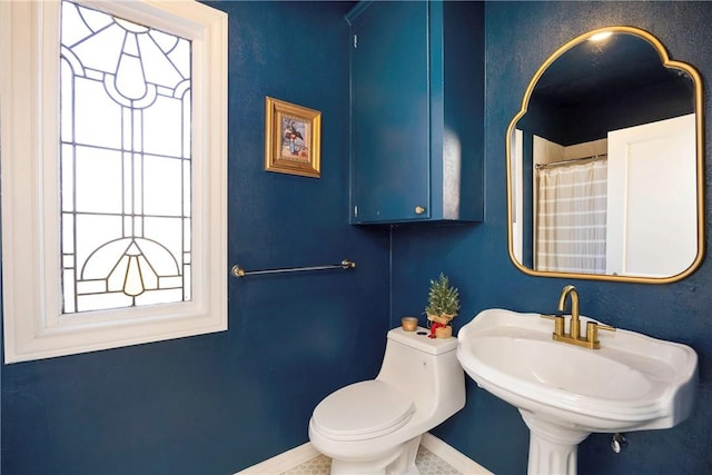 bathroom with sink and toilet