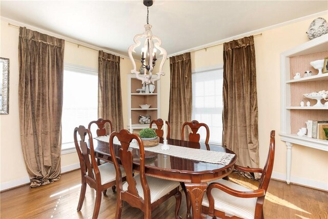 dining room featuring a chandelier and wood-type flooring