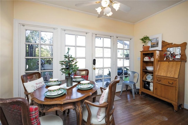 dining area featuring crown molding, ceiling fan, and dark hardwood / wood-style floors