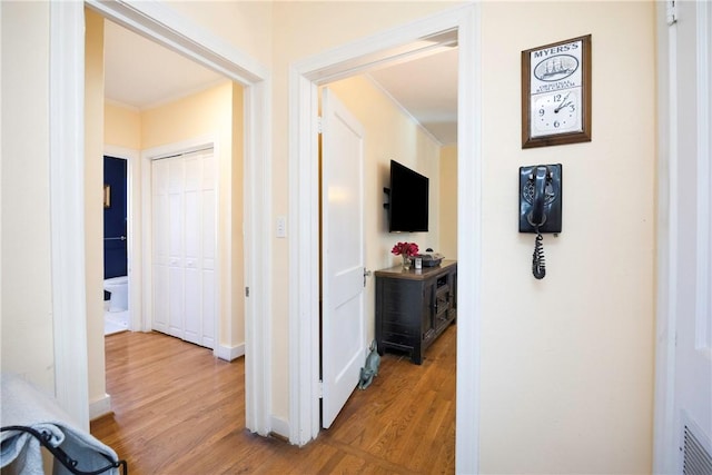 hall with light hardwood / wood-style flooring