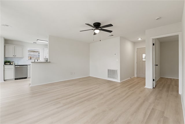 7926 Falcon Dr, Corpus Christi, TX 78414 - unfurnished living room featuring ceiling fan and light wood-type flooring