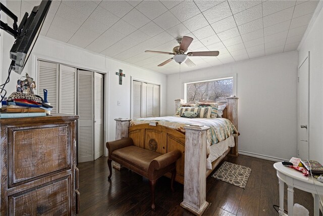 bedroom with ceiling fan and dark hardwood / wood-style floors