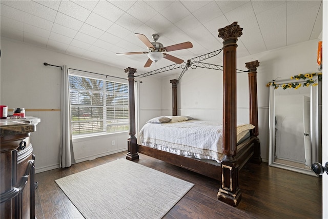 bedroom featuring dark hardwood / wood-style flooring and ceiling fan