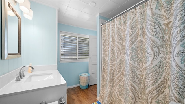 full bath featuring vanity and wood finished floors