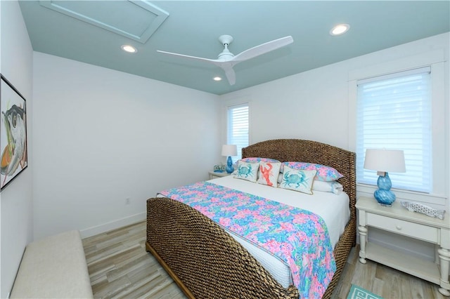 126 Reserve Ln, Rockport, TX 78382 - bedroom featuring recessed lighting, light wood-type flooring, ceiling fan, baseboards, and attic access
