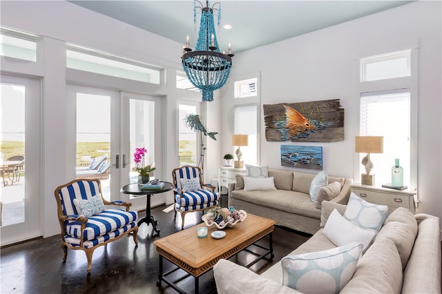 living room featuring french doors and a chandelier