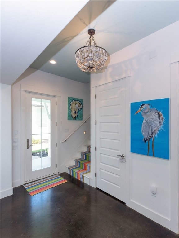 entrance foyer with a chandelier