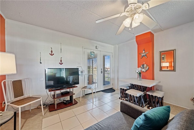 14300 S Padre Island Dr Unit 125, Corpus Christi, TX 78418 - living area featuring french doors, a textured ceiling, ceiling fan, and light tile patterned floors