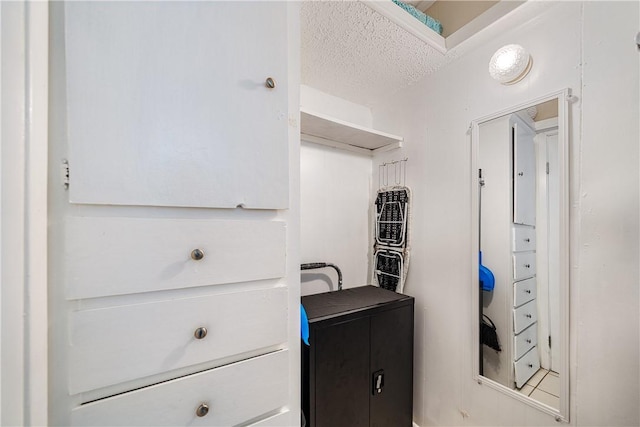 14300 S Padre Island Dr Unit 125, Corpus Christi, TX 78418 - bathroom featuring a textured ceiling