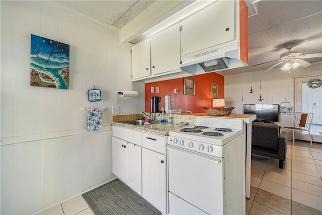 14300 S Padre Island Dr Unit 125, Corpus Christi, TX 78418 - kitchen with electric stove, a peninsula, light tile patterned floors, light countertops, and ceiling fan