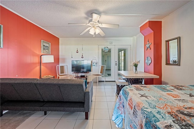 14300 S Padre Island Dr Unit 125, Corpus Christi, TX 78418 - bedroom featuring access to outside, light tile patterned floors, a textured ceiling, and a ceiling fan