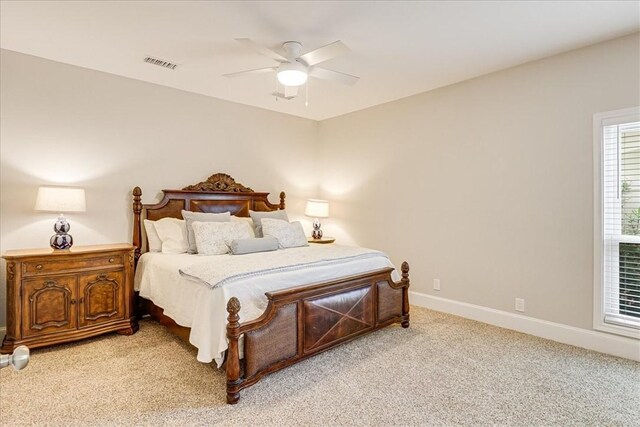 314 Bahia Mar Prt, Aransas, TX 78373 - bedroom with visible vents, a ceiling fan, baseboards, and light carpet