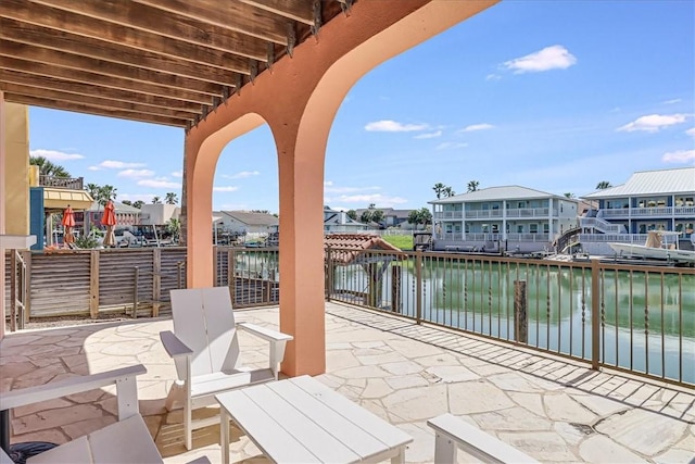 314 Bahia Mar Prt, Aransas, TX 78373 - view of patio with a residential view and a water view