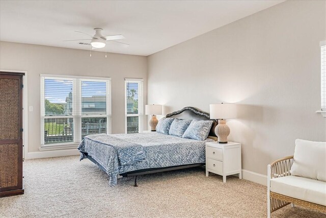 314 Bahia Mar Prt, Aransas, TX 78373 - bedroom featuring a ceiling fan, baseboards, and light carpet