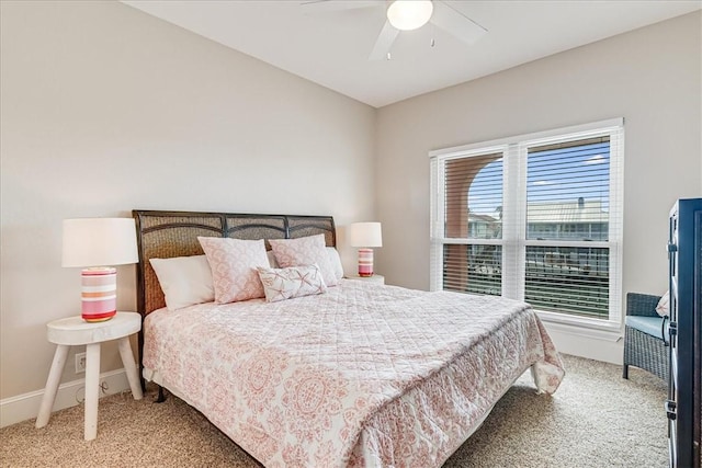 314 Bahia Mar Prt, Aransas, TX 78373 - bedroom featuring light carpet, a ceiling fan, and baseboards