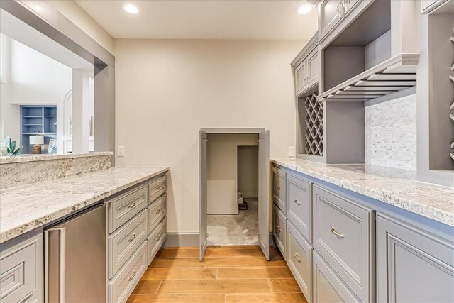 314 Bahia Mar Prt, Aransas, TX 78373 - bathroom featuring decorative backsplash, wood finished floors, recessed lighting, and vanity