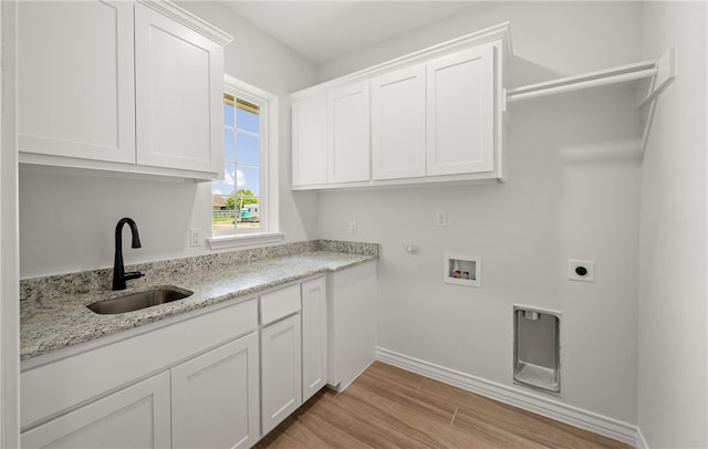 6202 Olivia St, Corpus Christi, TX 78415 - laundry room with cabinet space, gas dryer hookup, light wood finished floors, washer hookup, and hookup for an electric dryer