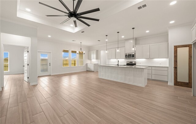 6202 Olivia St, Corpus Christi, TX 78415 - kitchen with appliances with stainless steel finishes, recessed lighting, backsplash, a ceiling fan, and white cabinets