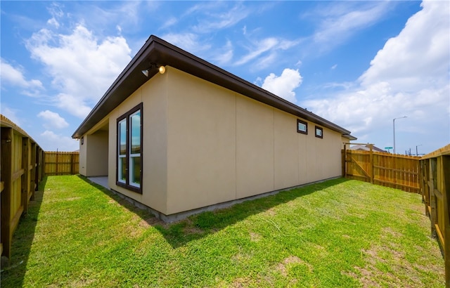 6202 Olivia St, Corpus Christi, TX 78415 - view of side of property with a fenced backyard and stucco siding