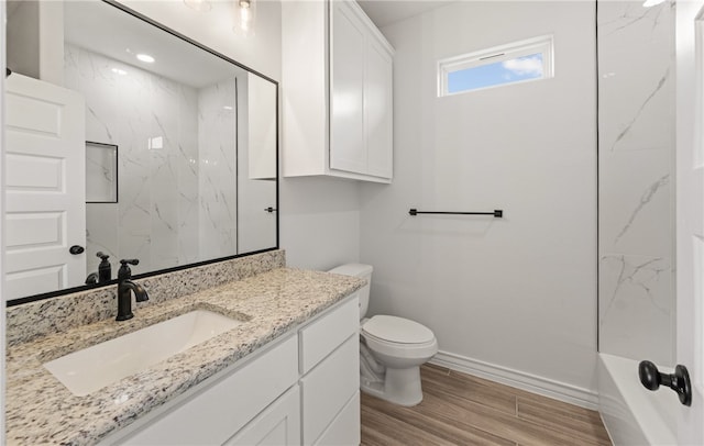 6202 Olivia St, Corpus Christi, TX 78415 - full bathroom featuring vanity, wood finished floors, and a combined bath / shower with marble appearance