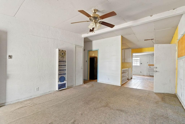 925 Hazel Dr, Corpus Christi, TX 78412 - unfurnished room featuring light colored carpet, ceiling fan, and a textured wall