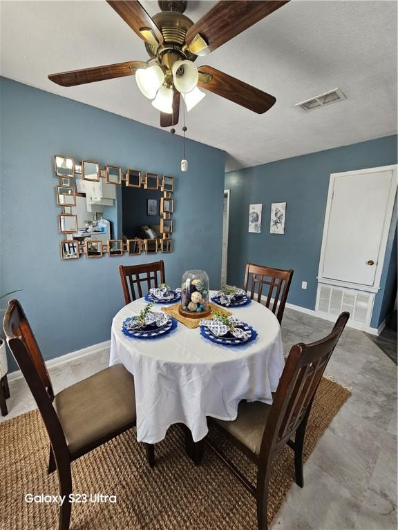 1330 Red Bird Dr, Rockport, TX 78382 - dining room featuring ceiling fan and baseboards