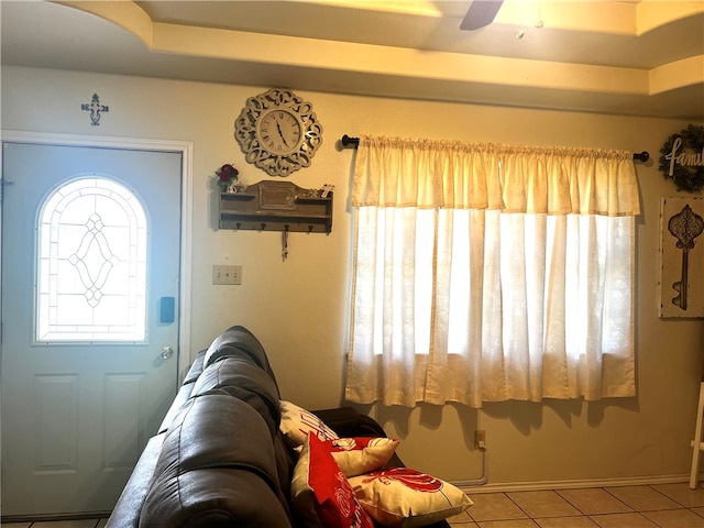 tiled foyer entrance featuring ceiling fan