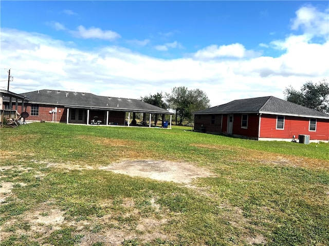 view of yard with central AC