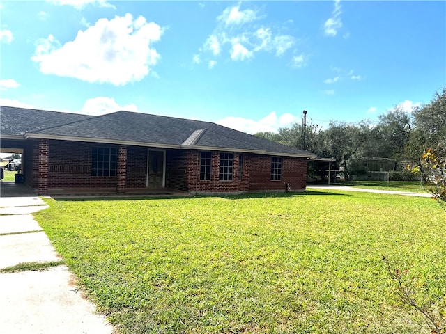 ranch-style house with a front lawn