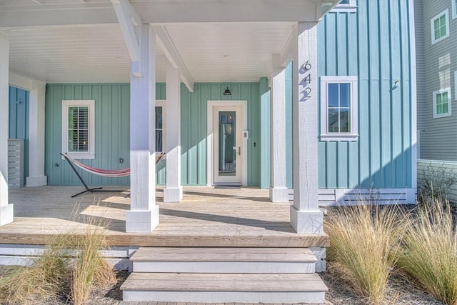 entrance to property featuring board and batten siding