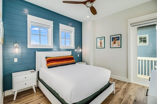 bedroom featuring ceiling fan, recessed lighting, wood finished floors, and baseboards