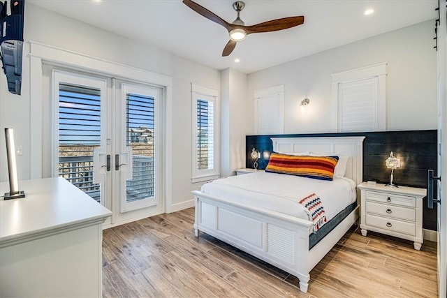 bedroom featuring access to outside, french doors, light wood finished floors, and recessed lighting