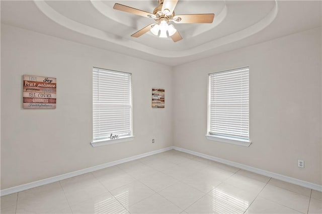 8230 Excalibur, Corpus Christi, TX 78414 - unfurnished room featuring ceiling fan, a raised ceiling, and light tile patterned flooring