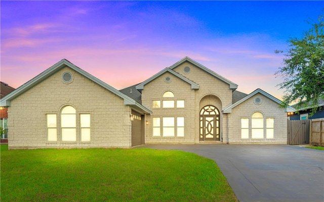 8230 Excalibur, Corpus Christi, TX 78414 - view of front of property featuring concrete driveway, brick siding, and a garage