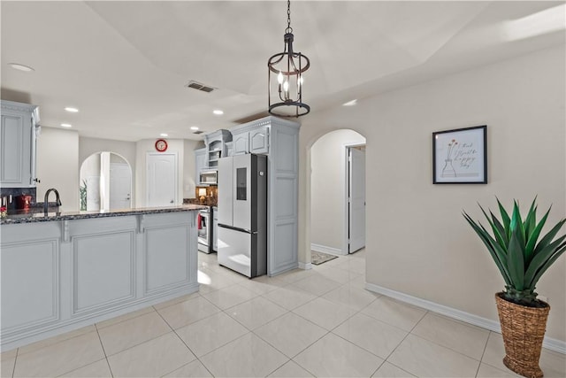 8230 Excalibur, Corpus Christi, TX 78414 - kitchen featuring stainless steel appliances, arched walkways, recessed lighting, a peninsula, and decorative light fixtures
