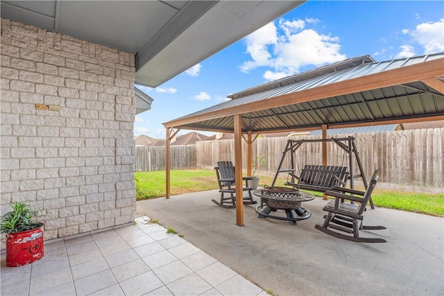 8230 Excalibur, Corpus Christi, TX 78414 - fenced backyard with a gazebo, an outdoor fire pit, and a patio area
