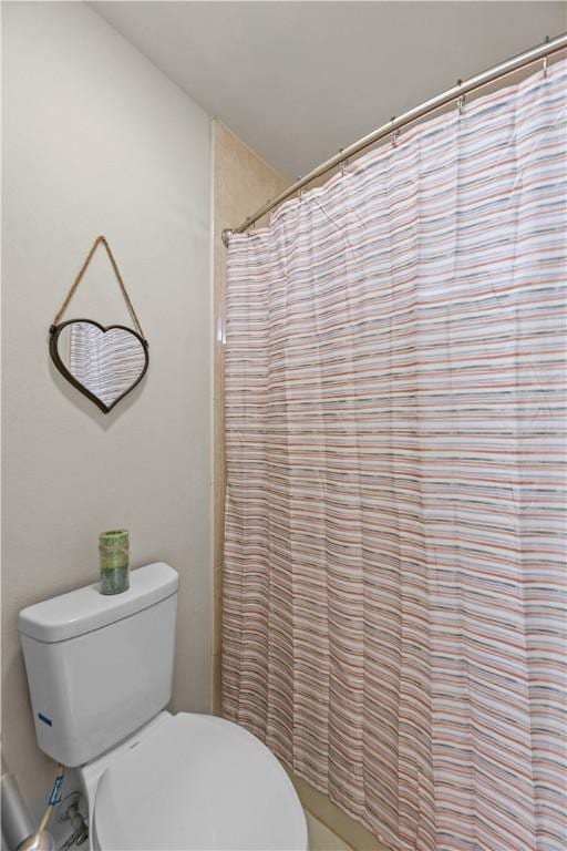 8230 Excalibur, Corpus Christi, TX 78414 - bathroom with toilet and a shower with curtain