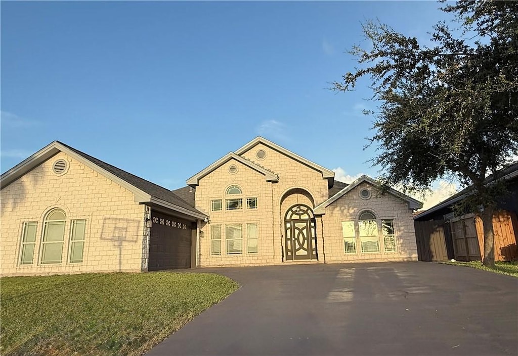 8230 Excalibur, Corpus Christi, TX 78414 - view of front of house featuring driveway and an attached garage