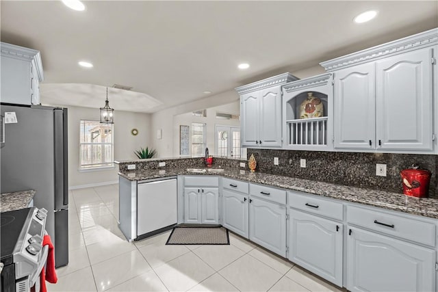 8230 Excalibur, Corpus Christi, TX 78414 - kitchen featuring dishwasher, stainless steel electric stove, a peninsula, light tile patterned floors, and decorative backsplash