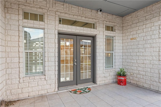 8230 Excalibur, Corpus Christi, TX 78414 - property entrance with french doors, a surveillance system, and stone siding
