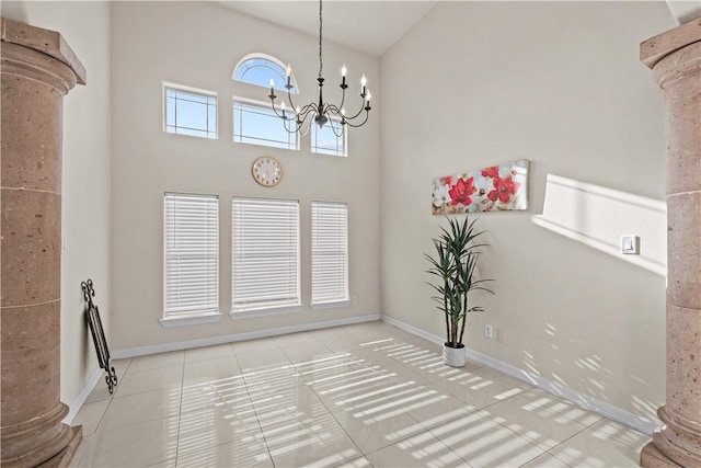 8230 Excalibur, Corpus Christi, TX 78414 - unfurnished dining area with decorative columns, tile patterned flooring, a chandelier, and high vaulted ceiling