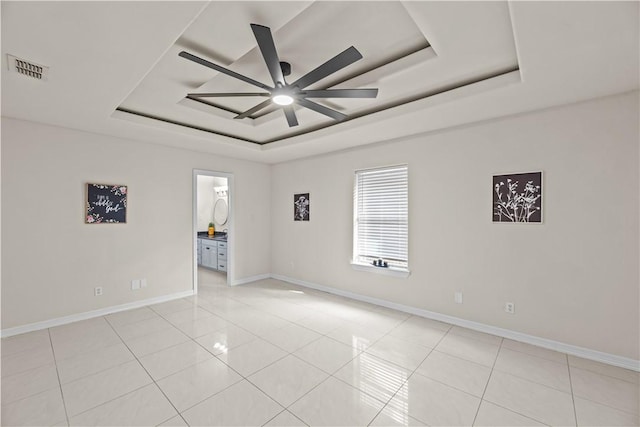 8230 Excalibur, Corpus Christi, TX 78414 - spare room featuring a tray ceiling, a ceiling fan, and light tile patterned flooring
