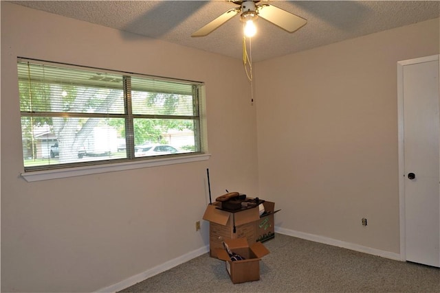 128 Granby Pl, Portland, TX 78374 - spare room featuring carpet floors, a ceiling fan, baseboards, and a textured ceiling